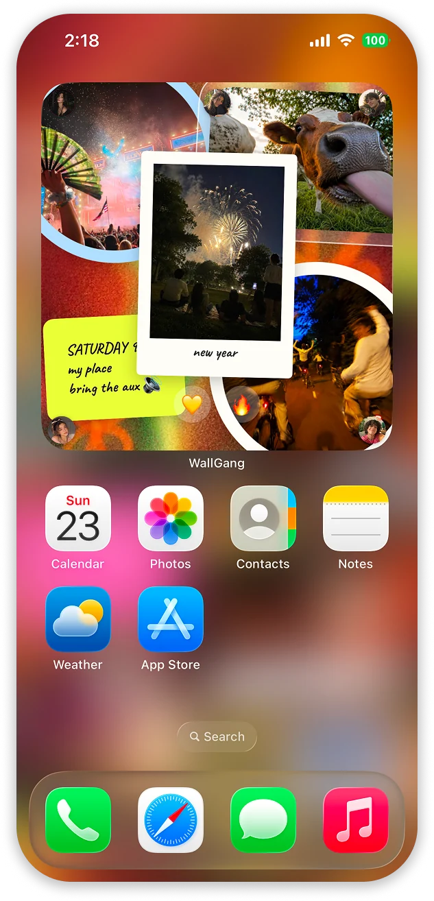 A WallGang widget on an iPhone Home Screen: four room photos in a collage, each tagged with the profile picture of whoever posted it, a polaroid captioned 'new year' laid over them, a sticky note about Saturday, and heart and fire reactions sitting on the wall